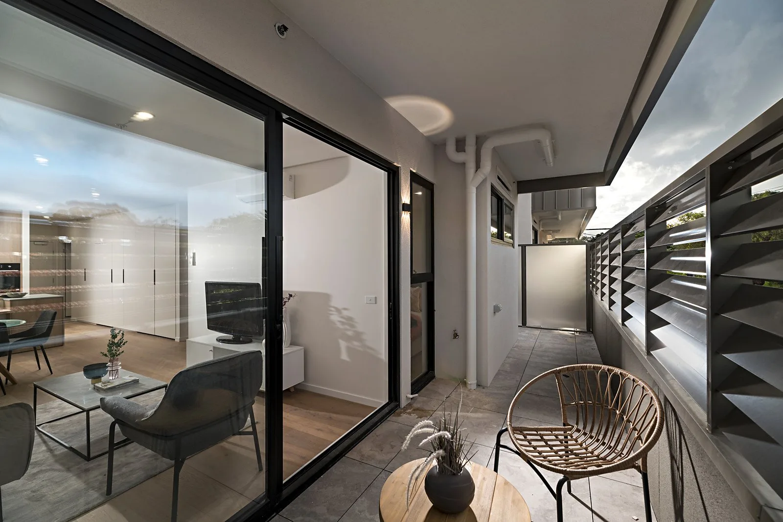 The Elm, Moonee Ponds: living area opening to a louvred balcony